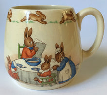 Load image into Gallery viewer, Royal Doulton Bunnykins - HW 12 Family at Breakfast / HW 2 Pulling on trousers - Don Mug BARBARA VERNON
